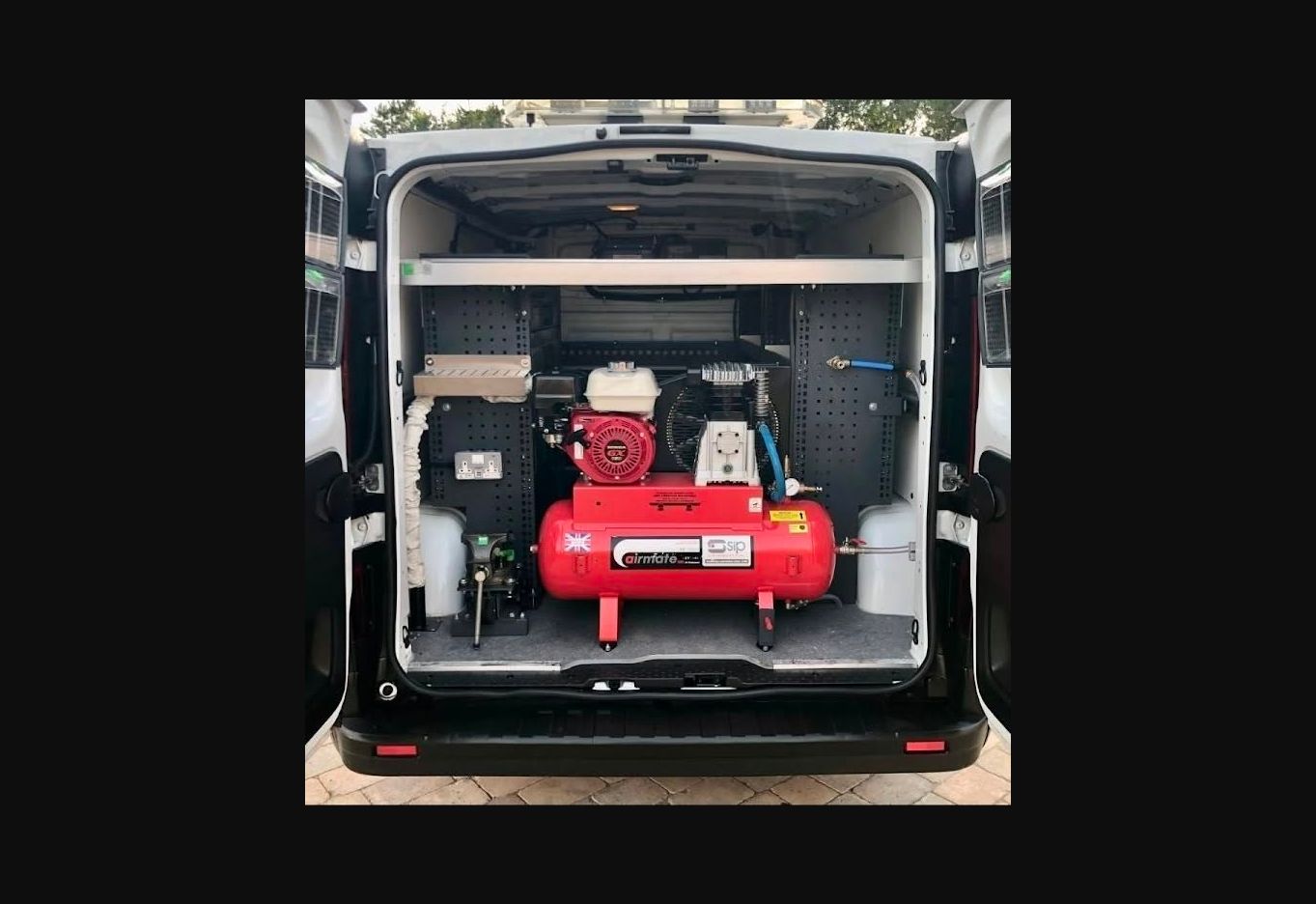 On-board compressed-air equipment fitted inside a service van
